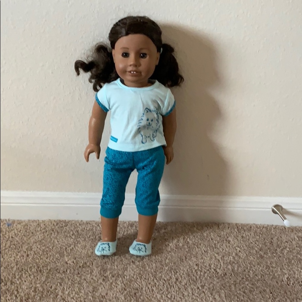 An American Girl Doll in pretty good condition.